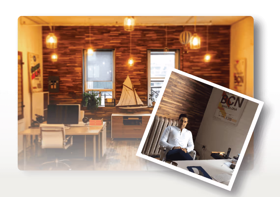 Warm wooden office with desk, sailboat model, and hanging lights
